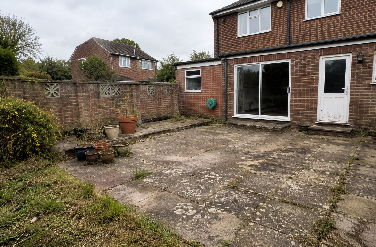 Before: Rear Garden Patio Transformation